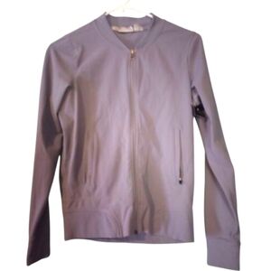 Athleta purple front zipper jacket with ribbed detailing and pockets